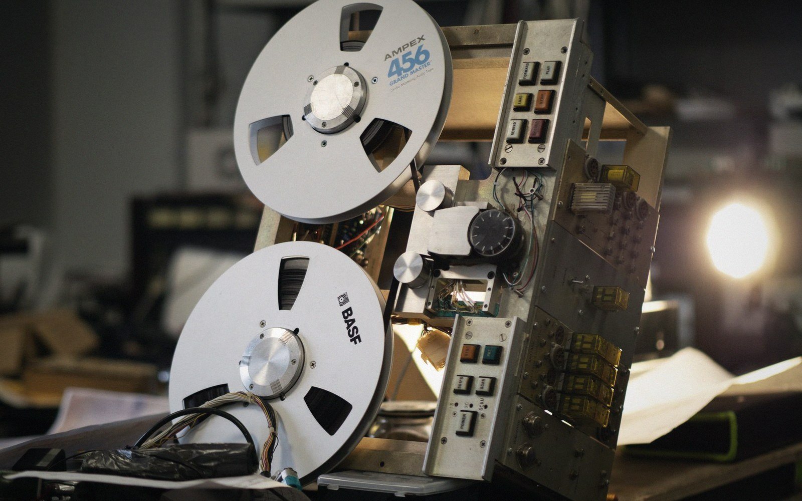 An archival-looking tape or card machine with an operator